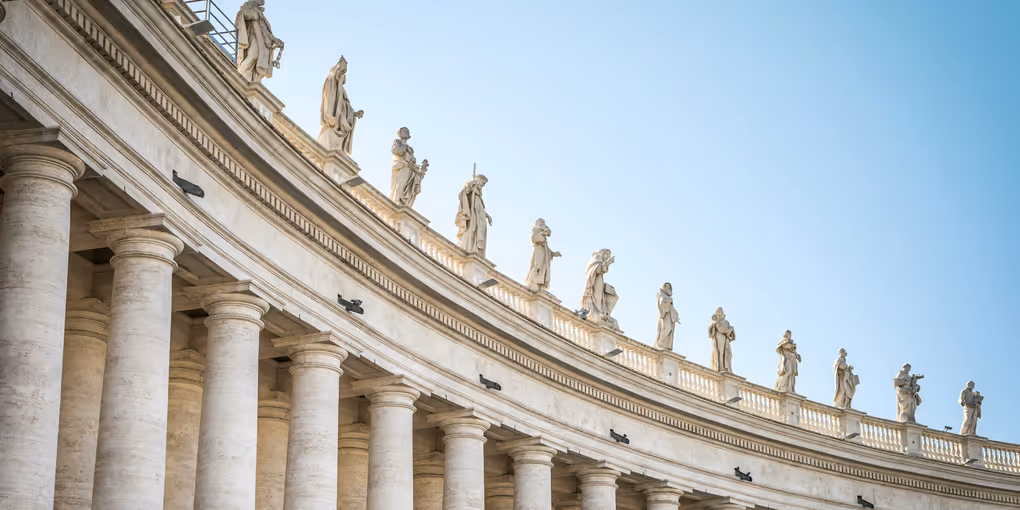 https://unsplash.com/photos/concrete-statue-on-top-of-building-during-daytime-cFeRWofFkw8